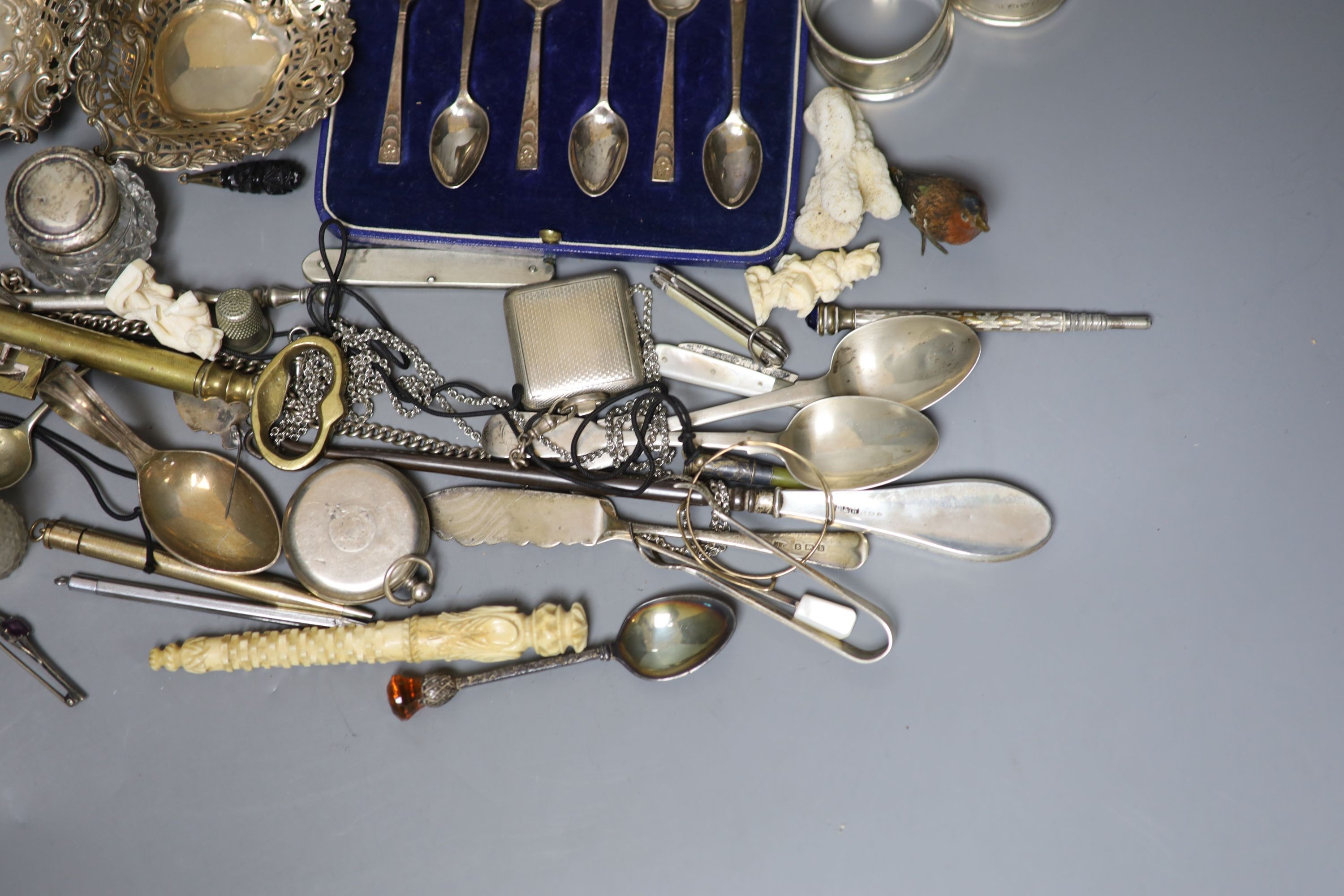 Mixed small silver and other collectable including a cased set of silver silver coffee spoons, a George III silver cream jug, bonbon dishes, cigarette cases, vesta case, flatware, scent bottles, a cold painted bronze bir